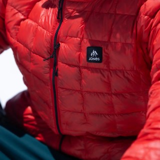 Jones rider Inaki Odriozola wears the Men's Ultra Re-Up Down Recycled Jacket in Lava Red